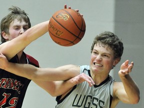 Tanner Moss (left) of Terry Fox and Walnut Grove's Ethan McKean battle for a loose ball during Friday's Fraser Valley Triple A semifinals at the Langley Events Centre. (Ian Lindsay, PNG)