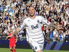 Whitecaps striker Eric Hassli celebrates one of his two goals against Toronto FC during the Whitecaps' first-ever MLS game in March 2011 at Empire Field in Vancouver.