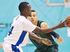 UVic Vikes Michael Acheampong plays the ball around Fraser Valley Cascades Jordan Blackman in Canada West basketball action at McKinnon Gym in Victoria, B.C. January  13, 2012. DARREN STONE, TIMES COLONIST