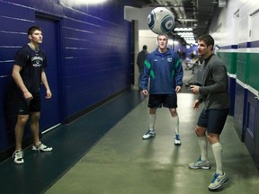 Kevin Bieksa (right) and Chris Tanev (left) are both day-to-day, but both are expected to be ready to go come playoffs.
