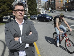 Vancouver Coun. George Affleck stands at the corner of Burrard  Street and Pacific Boulevard pondering why there has been an increase in accidents involving bikes and cars at the entrance to the bike lanes over the bridge. (Jason Payne/PNG FILES)
(For story by Sam Cooper)