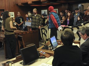 About 50 protesters from the Downtown Eastside Not For Developers Coalition occupied the council chambers at Vancouver city hall on Tuesday. (Jason Payne/ PNG FILES)