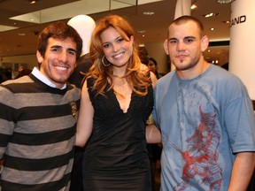 NEW YORK - OCTOBER 07: (L-R) Kenny Florian, Mandy Moore and Jon Fitch attend the book launch of Reed Krakoff's portrait book titled 'Fighter: The Fighters of the UFC' at Barneys on September 9, 2008 in New York City. (Photo by Donald Bowers/Getty Images for Coach)