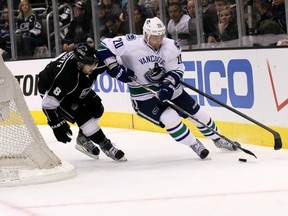 The Canucks' Chris Higgins attempts to get around stalwart Kings defenceman Drew Doughty during Game 3 at the Staples Center in Los Angeles. Getty Images photo.