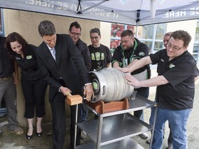 Mayor Gregor Robertson taps the first cask at last year's Vancouver Craft Beer Week. (Brian K Smith Photography)
