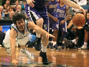 The Sacramento Kings' Jimmer Fredette fends off a diving Ricky Rubio of the Minnesota Timberwolves in the quest for a loose ball at the Target Center in Minneapolis, Minnesota, on Tuesday, February 7, 2012. (Jerry Holt/Minneapolis Star Tribune/MCT) [PNG Merlin Archive]