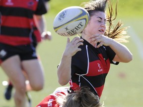 Abby Collegiate's Jumaya Murphy is tackled by Carson Graham's Brandy Perry during BC 7s tourney. Carson holds the top 3A seed and Abby the top 2A seed heading into the BC full 15 this weekend. (Gerry Kahrmann, PNG)