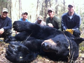 Canucks winger David Booth and friends gets some R&R at the expense of a black bear.