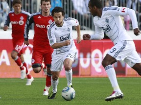 Whitecaps' Davide Chiumiento in action on MLS opening day 2011. (Photo by Jeff Vinnick/Getty Images)