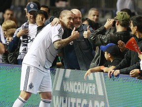 Whitecaps' forward Eric Hassli is getting married this weekend in Las Vegas. Not to this guy. (Jeff Vinnick/Getty Images)