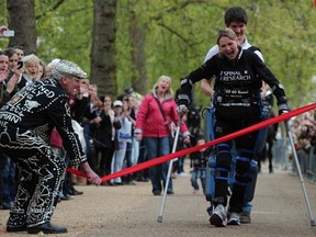 Claire Lomas of London becomes the first person to ever complete a marathon in a bionic suit.