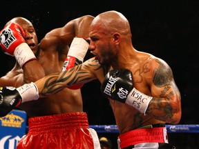 LAS VEGAS, NV - MAY 05:  (R-L) Miguel Cotto throws a right punch at Floyd Mayweather Jr. during their WBA super welterweight title fight at the MGM Grand Garden Arena on May 5, 2012 in Las Vegas, Nevada.  (Photo by Al Bello/Getty Images)