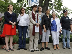 From left, partners Sara Schwartz-Sax and Meg Coward; activists Rev. Jasmine Baech-Ferrara and Katie Watson; and partners Barb Goldstein and Ann Willoughby, and Michele Sager and Joyce Heflin, stand during a short prayer service outside of the Durham County Register of Deeds office on Wednesday, May 9. The sets of partners applied for marriage licenses Wednesday, but were denied. (MCT)