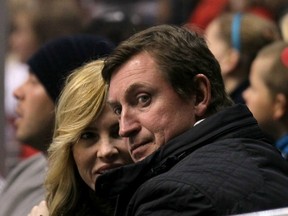 Wayne Gretzky and wife Janet Jones-Gretzky take in a Kings-Red Wings game at the Staples Center in Los Angeles in March. Getty Images photo.
