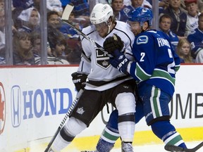 Vancouver Canucks defenceman Dan Hamhuis ties up Anze Kopitar of the Los Angeles Kings in Game 5 of their NHL playoff series last round.