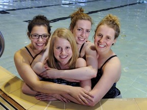 UBC swimmer Hayley Pipher (center) and teammates Erin Assman (left) Fionnuala Pierse (2nd from right) and Laura Thompson (far right). (Les Bazso, PNG)