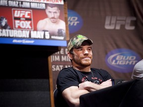 NEW YORK - MARCH 06:   UFC lightweight Jim Miller listens to opponent Nate Diaz during a press conference at Radio City Music Hall on March 06, 2012 in New York City.  UFC announced that their third event on the FOX network will take place on Saturday, May 5 from the IZOD Center in East Rutherford, N.J.. (Photo by Michael Nagle/Getty Images)
