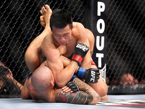 Fairfax, VA - May 15, 2012: Dustin Poirier (Blue trunks) and Chan Sung Jung (White trunks) during the UFC on FUEL TV 3  main event at the Patriot Center in Fairfax, Virginia.  Ed Mulholland for ESPN.com