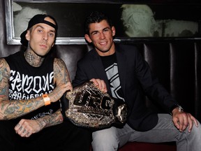 UFC bantamweight champion Dominick Cruz, seen here with kick-ass drummer Travis Barker, will now defend his title against fellow TUF 15 coach Urijah Faber in the co-main event of UFC 148 on July 7 in Las Vegas. (photo by Ethan Miller/Getty Images for Studio 54)
