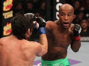 SUNRISE, FL - JUNE 08:   (R-L) Demetrious Johnson punches Ian McCall in a Flyweight bout during the UFC on FX 3 event at Bank Atlantic Center on June 8, 2012 in Sunrise, Florida.  (Photo by Josh Hedges/Zuffa LLC/Zuffa LLC via Getty Images)