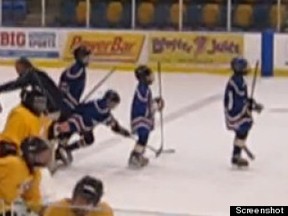 Frame from video showing Vancouver coach tripping two 13-year-olds from the opposing Richmond team in the handshake line after a game on Saturday at the University of B.C.
