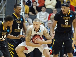 Gonzaga senior Rob Sacre protects rebound in NCAA tournament game versus West Virginia. (PNG wire photo)