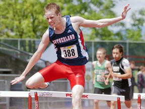 Matt Swanson didn't exactly wield the artist's brush as he finished the 400 hurdles Saturday at Swangard, but he pulled off the toughest double gold in the book. (Wilson Wong, PNG)