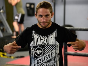 SACRAMENTO, CA - JUNE 26: Chad Mendes points to his t-shirt before he starts working out for the media during the Team Alpha Male Media Open Workout at Ultimate Fitness Gym on June 26, 2012 in Sacramento, California. (Photo by Thearon W. Henderson/Getty Images)