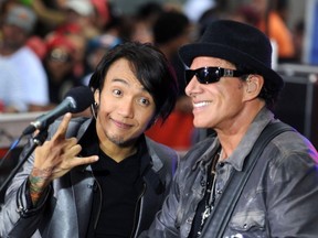 Arnel Pineda and Neal Schon of the music group Journey perform on NBC's "Today" show at Rockefeller Center in New York City on July 29, 2011. (Dennis Van Tine/Abaca Press/MCT)