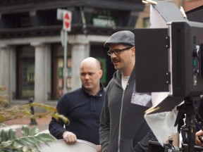 Joe Klymkiw (in glasses and hat) at work