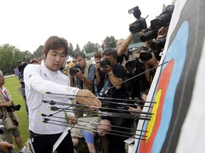 Legally blind Korean archer  Im Dong Hyun was in top form Friday, setting two world records at Lord's Cricket Ground. AP photo Marcio Jose Sanchez