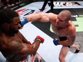 PORTLAND, OR - JULY 14:   Nate Marquardt plants a right hand on the face of Tyron Woodley during their welterweight bout at the Strikeforce event at the Rose Garden on July 14, 2012 in Portland, Oregon.  (Photo by Esther Lin/Forza LLC/Zuffa LLC via Getty Images)