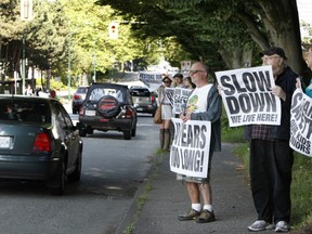 Prior Street at Hawks Avenue was the scene of an protest Friday morning as Strathcona residents urged motorists to slow down. Residents want less traffic on Prior as part of proposal to remove the Dunsmuir and Georgia street viaducts. (Kim Stallknecht/PNG)