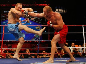 Tim Boetsch (right) punches fellow UFC veteran Vladimir Matyushenko in the mush during their IFL days. (Photo by Rob Tringali/Getty Images for IFL)