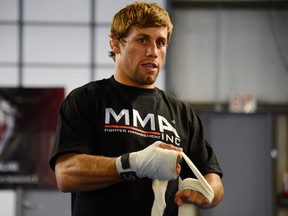 SACRAMENTO, CA - JUNE 26: Urijah Faber wraps his hands before he works out for the media during the Team Alpha Male Media Open Workout at Ultimate Fitness Gym on June 26, 2012 in Sacramento, California. (Photo by Thearon W. Henderson/Getty Images)