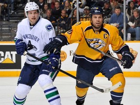 The Vancouver Canucks figured it wasn't worth it to offer Shea Weber (right) more than a one-year term since Nashville has indicated it would match any offer for longer, president and general manager Mike Gillis said. Meanwhile, Gillis touted Alex Edler, to the left of the Norris runner-up Weber, as a future Norris candidate.