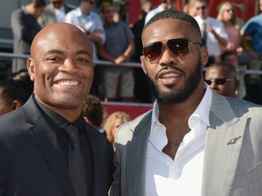 Anderson Silva (left) has come away from the chaos surrounding UFC 151 like a stand-up guy. The man on his right could learn a few things from his middleweight colleague. (Photo by Frazer Harrison/Getty Images)