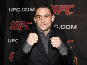 NEW YORK, NY - JANUARY 13: Frankie Edgar, then UFC lightweight champion, poses during a press conference to announce commitment to bring UFC to Madison Square Garden and New York State at Madison Square Garden on January 13, 2011 in New York City.  (Photo by Michael Cohen/Getty Images)