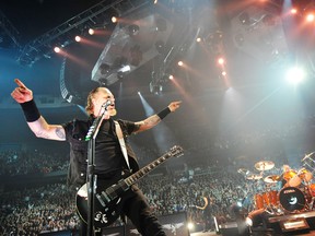 Metallica frontman James Hetfield reigns supreme at GM Place Stadium in Vancouver during a concert on Dec. 2, 2008. The band has announced a $5 charity show on Monday, Aug. 27 to allow for additional filming for the band's upcoming 3D movie, slated for release in 2013. (RIC ERNST/PNG)