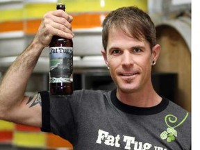 Driftwood's 'Wizard of Wort' Jason Meyer with the brewery's Fat Tug IPA. (Photo: Adrian Lam/Times Colonist)