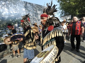 Several hundred members of the Musqueam First Nation and supporters tied-up traffic on Granville Street during Aug. 10 protest. (Jason Payne/ PNG FILES)