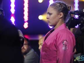 Strikeforce bantamweight champion "Rowdy" Ronda Rousey prepares to enter the cage for her first Strikeforce appearance against Sarah D'Alelio on August 12, 2011. (photo courtesy of Esther Lin/All Elbows)