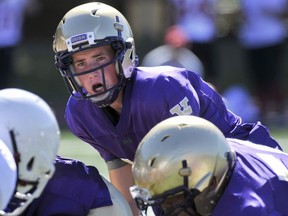 Angus Ker pictured in action Friday at O'Hagan where his three TD passes lifted the Fighting Irish past Mt. Boucherie. (Les Bazso, PNG)