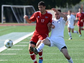 Simon Fraser Clan striker Carlo Basso (left), in exhibition action against Vancouver Island University earlier this season, is one of the key cogs in the NCAA Div. 2 powerhouse team residing atop Burnaby Mountain. (Photo -- SFU athletics)