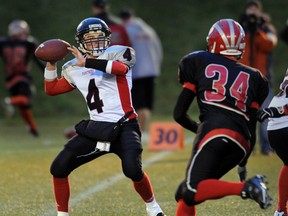 Abbotsford Panthers quarterback Carter Williams (left) faces the Barsby defence in Subway Bowl playoffs last November. (PNG photo)