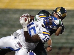 UBC's Daniel English is roughed up Friday in Regina by the Rams. (Regina Leader Post photo)