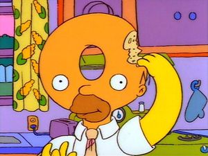 Homer takes a bite out of his ‘donut head’ in an episode of The Simpsons: Treehouse of Horror. (GOOGLE IMAGE)