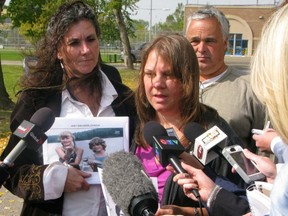 Shelley Boden (left) and Kelly Nielsen (right) talk to reporters at the Bowden Institution in Bowden, Alta., Tuesday, Sept. 18. The two women were arguing against granting parole to B.C. mass murderer David Shearing. (CP)