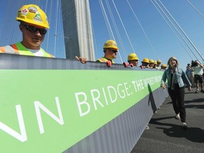 Transportation and Then-infrastructure minister Mary Polak arrived on the deck of the new Port Mann Bridge on Sept. 13, 2012, in a 1964 Mercury Comet to announce there will be no tolls for drivers on the bridge for the first week of operation. Polak also proclaimed the bridge to be the widest in the world, as recognized by the Guiness Book of World Records. Several hundred workers who helped build the bridge took part in the festivities to celebrate the near-completion of the new Port Mann bridge. (Jason Payne/PNG FILES)