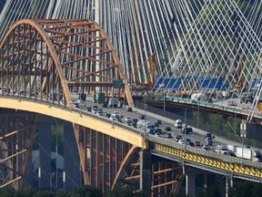 Many people are questioning the plan to knock down the relatively young, original Port Mann Bridge, the orange one on the left, saying we'll regret the decision in the future. (Nick Procaylo/PNG)